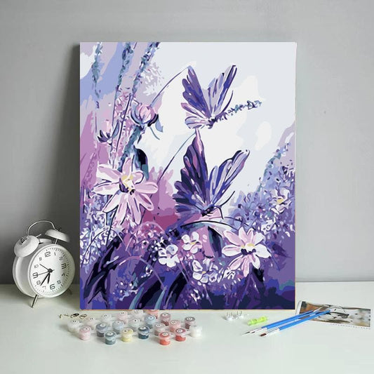 Purple butterflies fly in purple flowerfield